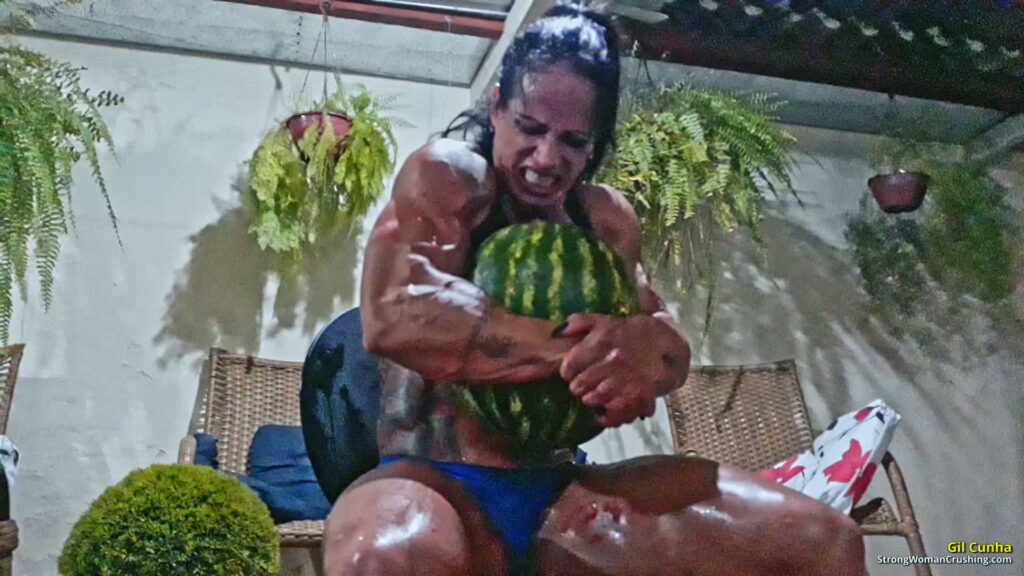 Gil Cunha destroys watermelons using her muscular arms - muscular woman strength video