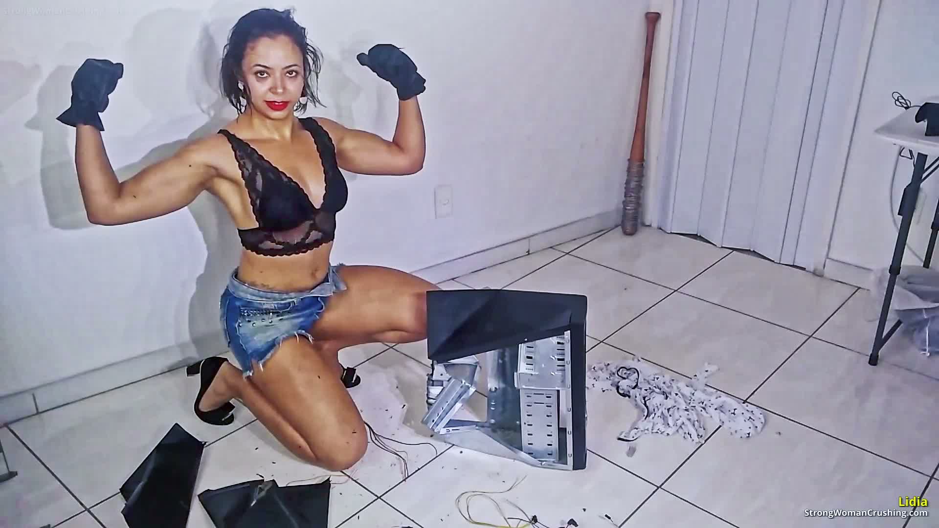 Lidia destroys a computer with her strength