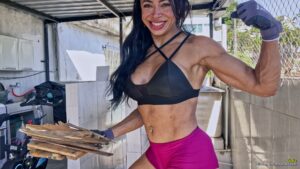 Lidia test her strength against a wooden box